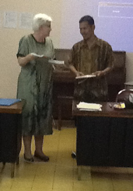 Dr. Nancy Easley shares a copy of Drs. Rosebrough and Leverett's book, Transformational Teaching, in Indonesia.