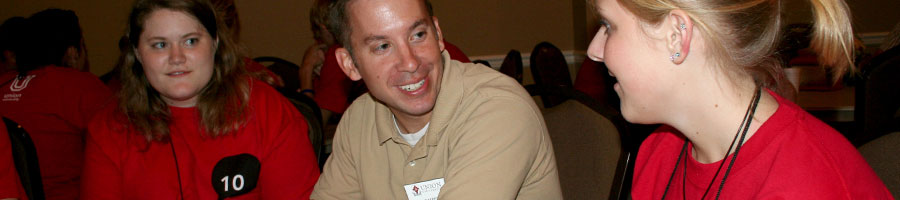Dr. Kerfoot talks with incoming new students during Focus Week's Dinner with you Department.