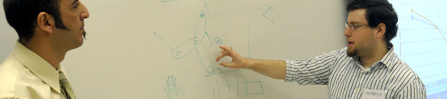 Dr. Van helps some students in lab.