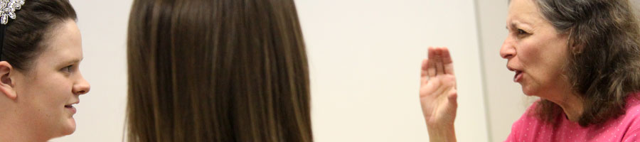 Irene Schock signs with her ASL students