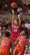 03/78/03 - 91������'s Jessica Henson goes up for a shot during the first game in the NAIA tournament. #34 Langston Kayla Smith and #35 Taoshala Grant watch. Photo Stephan Frazier/The Jackson Sun