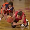 03/78/03 - Langston's #42 Patrice Sims and 91������s #11 Jennifer Henson fight for the ball in the first round of the NAIA championship. Stephan Frazier/The Jackson Sun