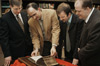 3/14/03 - Ray Van Neste, George Guthrie, Carl Trueman & Brian Denker examine the 1615 Geneva Bible that was recently acquired by the R. C. Ryan Center for Biblical Studies.  Carl Trueman, associate professor of church history and historical theology at Westminster Theological Seminary, was on campus recently to speak on the history of the Geneva Bible.