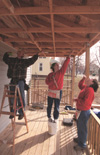 3/26/03 - Sarah Orr (center) and India Hickman (right) assist with the efforts of Battle Creek's Habitat for Humanity.