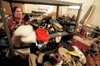 3/24/03 - Andrea Hudgins sorts shoes at the Salvation Army's Purdue Center of Hope during GO Memphis.