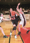 03/81/03 - Junior forward Ginger Bryant charges to the basket at the national NAIA tournaments. Bryant has contributed 1,119 points and 672 rebounds during her career. In addition, Bryant received honorable mention NAIA All-American honors. The Lady Bulldogs’ season ended in the second round of the tournament with a 34-3 record.