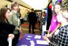 Mallory Dunseath and Amy Armstrong, representatives from FedEx, speak with Libby Ford, senior accounting major, and Karen Miller, accounting professor, about opportunities at FedEx during the CareerU fair.  - Photo by Kristi McMurry