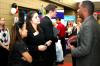 Rachel Vo, senior family studies major, and Brandy Hudgins, career services secretary, talk with Brian Watson about career opportunities during the CareerU fair.  - Photo by Kristi McMurry