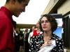 Danny Song, senior journalism major, talks with Rachel Hughes about career opportunities at the CareerU fair.  - Photo by Kristi McMurry