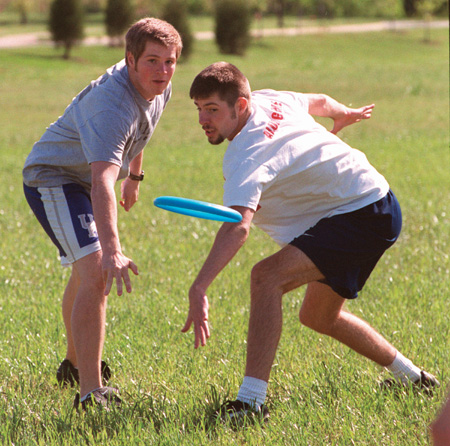 Assignment: Ultimate Frisbee Intramurals - Freshmen Daniel Holsinger, biology major, and Jason Nolan, Christian studies major, wonder which team will catch the frisbee once it's out of their hands.