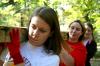 Elizabeth Blevins, sophomore political science major, Lauren Bogdan, junior Biblical studies major, and Sarah Conway, senior chemistry major, team together to transport a long cedar plank to a bog bridge construction area during Day of Remembrance. - Photo by Kristi McMurry