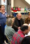 Megan March, senior art major, chats with the families of art faculty members Chris Nadaskay and Lee Benson at the annual art department Thanksgiving dinner. - Photo by Kristi McMurry