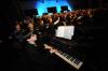 The 250-voice community choir and 30-piece orchestra warm up before <em>Remembering Feb. 5: An Evening of Thanksgiving</em>. - Photo by Morris Abernathy