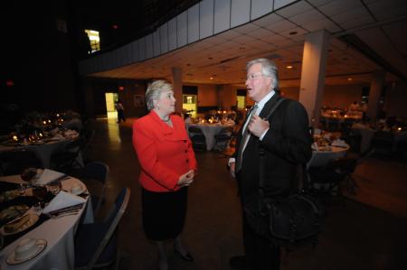 Jim Veneman, assistant professor of communication arts, talks with First Lady Lanese Dockery before the guests arrive at <em>Remembering Feb. 5: An Evening of Thanksgiving</em>.