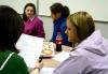 2/17/09 - Students participating in the Language capstone group look over each other's papers. - Kristi McMurry