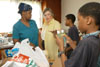 Union's First Lady Lanese Dockery (center) delivers food, water and encouragement to East Jackson residents Betty Haynes,  Michael Dixon and Joseph Dixson. - Photo by Jim Veneman