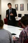 Wagner Oliviera, senior DMS art major, presents his design for the annual literary magazine The Torch.  Staff members from The Torch reviewed each design and will select one student to design the magazine. - Photo by Kristi McMurry