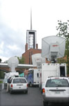 Satellite trucks from Memphis and Nashville television stations broadcast live from First Baptist Church, Jackson during the citywide prayer service. - Photo by Jim Veneman