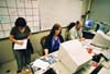 With their power off and a deadline to meet, the <i>Jackson Sun</i> set up camp in the University Relations office to put out their first two issues after the strom.   - Photo by Justin Veneman