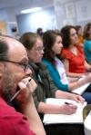 Lee Benson, chair of the art department, listens along with his students to Mark Shapiro during a ceramics workshop. - Photo by Kristi McMurry
