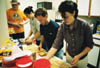 Union students (left to right) Jonathan Blair, Erin Hetzel, Sam McMinn, and Valerie Burnett prepare lunch for tornado victims.

 - Photo by Lindsay Stavish