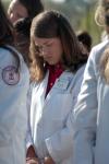 4/17/09 - Pharmacy student Megan Rowlett prays during the groundbreaking ceremony of the new academic building for the School of Pharmacy. - Beth Spain