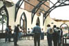 Members of the destroyed Episcopal church in downtown Jackson hold a prayer service in the shell of their former building. - Photo by Justin Veneman