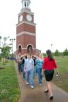 Haley Gallagher, sophomore business administration major, gives prospective students and their family members a tour of the campus during a preview day.  - Photo by Kristi McMurry