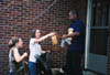 Freshman Brooke Fowler and Junior Nursing major Carlyn Reeves deliver sack lunches and bottled waters to a tornado victim in downtown Jackson. - Photo by Justin Veneman