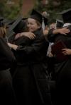 Tiffany Fredericks, French graduate, hugs a friend at the conclusion of the spring commencement service. - Photo by Angela Abbamonte