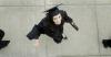 5/23/09 - International business graduate Ashley Ennis heads to the Great Lawn for spring graduation. - Beth Spain