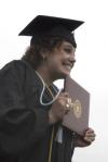 5/23/09 - Theatre graduate Natalie Newberry celebrates as she receives her diploma during spring graduation. - Sarah Palmer
