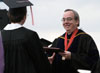 President Dockery presents Sara Horn with her undergraduate degree at Spring Graduation 2003. - Photo by Jim Veneman