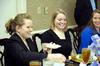 Sarah Eastin, senior marketing major, passes the butter to Bethany Morse, director of the Hundley Center, at the 2009 Etiquette Luncheon. This annual event teaches students proper interview etiquette. - Photo by Kristi McMurry