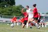 08/231/09 - Steffi King, freshman, dribbles through two Christian Brothers opponents toward the goal. 