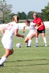 08/231/09 - Steffi King, freshman, keeps the ball away from her Christian Brothers opponent as Katelin Dirksen (27) moves into position.