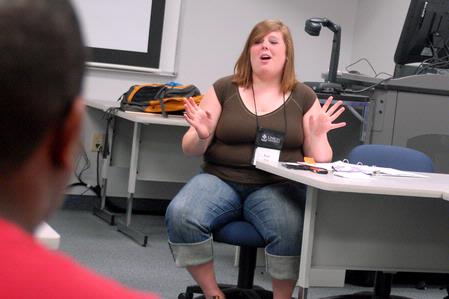 Katy Pope, senior art major, explains a game to her Focus group. 