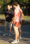 Cross country head coach Gary Johnson talking with his runners prior to practice. - Photo by Steven Aldridge