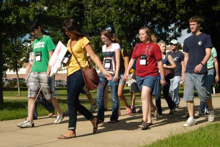 Hailey Gallagher, junior marketing major, leads her Focus group over to Jennings Hall.