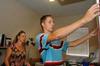 Senior Brandon Moore and his mother Michelle Moore organize his room as he moves into his room in the Quads. - Photo by Beth Spain