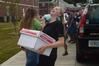 Katherine Pullen, sophomore ICS/Journalism major, laughs as she moves boxes into her room in the Quads. - Photo by Sarah Palmer