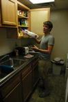 Andy Seaton, sophomore Christian studies/history major, unpacks his things into the kitchen of his room in the Quads. - Photo by Sarah Palmer