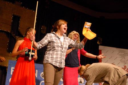 One of the freshman winners celebrates at the SAC game show. This annual game show is a way for freshmen to win prizes and have fun.