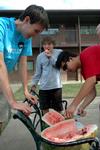 08/242/09 - Freshmen Jonathan Gwattney, Will Paul and James Liu in the Heritage complex enjoy watermelon on a warm Sunday afternoon.