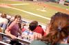 Kristen Voorhies, senior music major, turns around to talk to friends at the Diamond Jaxx game. The Diamond Jaxx hosted a college night, and many faculty and students came out for the game. - Photo by Kristi McMurry