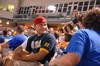 Alex Shepherd, junior business administration major, watches the Diamond Jaxx game and fellowships with friends at Pringles Park on college night.  - Photo by Kristi McMurry