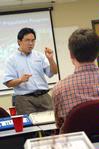 Haifei Li, professor of computer science, introduces speakers for an ACM meeting. - Photo by Kristi McMurry