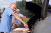 John Winfree, junior Christian Studies major, helps cook a meal for the Intrafraternity council (IFC) cookout.  This is one of the many events during RUSH.  - Photo by Kristi McMurry