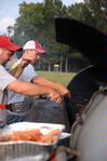 Scott Riessen, junior Christian Studies major, helps cook a meal for the IFC cookout.  This is one of the many events during Rush.  - Photo by Kristi McMurry