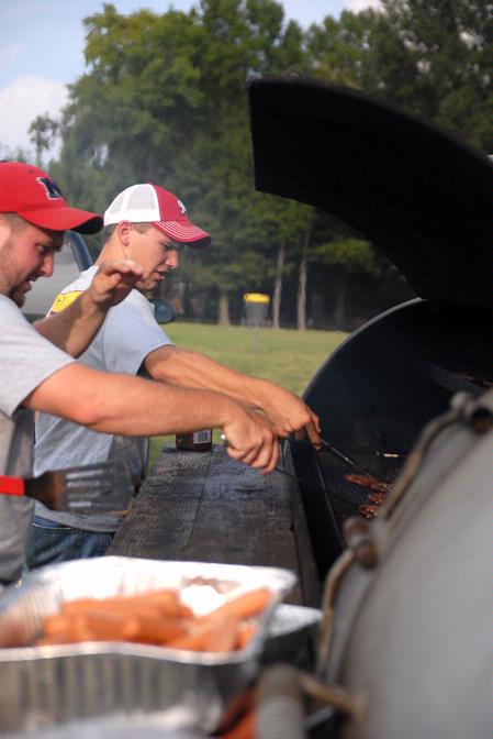 Scott Riessen, junior Christian Studies major, helps cook a meal for the IFC cookout.  This is one of the many events during Rush. 